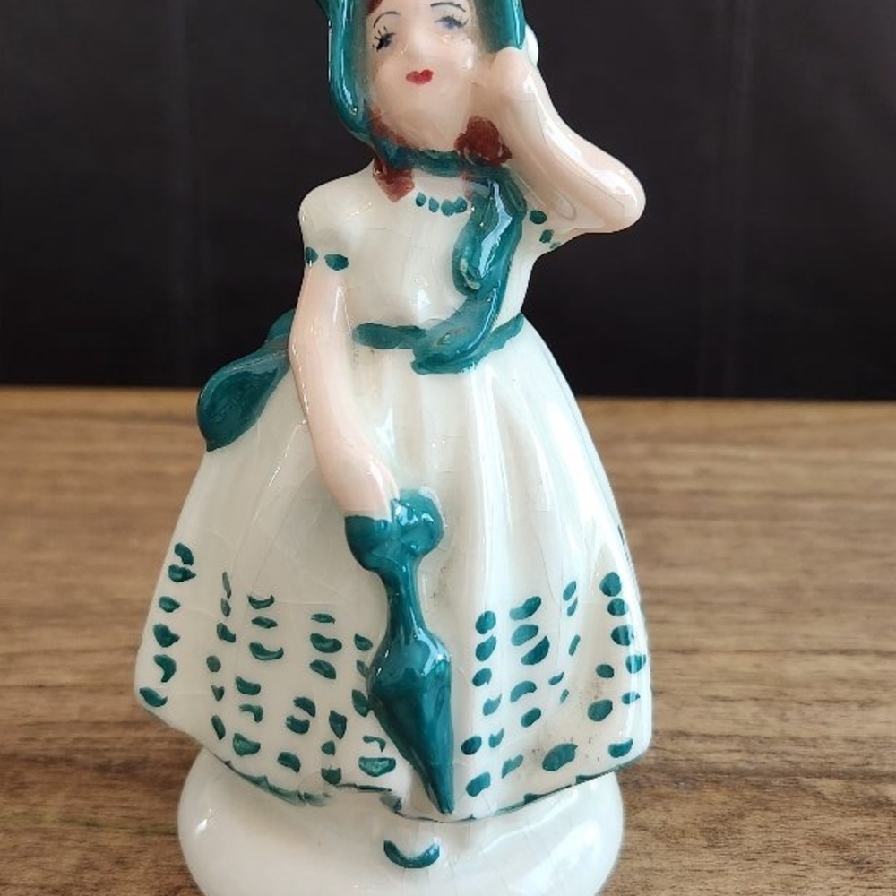Charming Ceramic Figurine in Teal and White